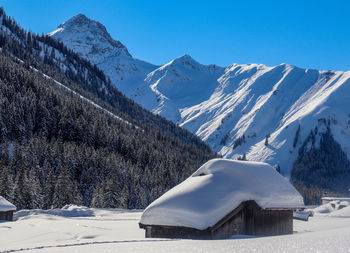 Snow covered mountains against sky