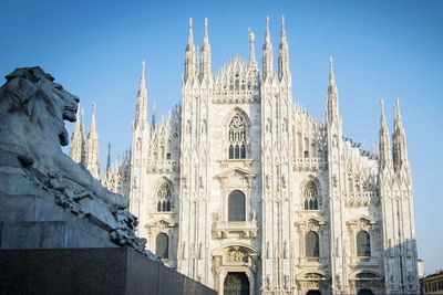 Duomo di milano against clear blue sky in city