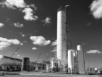 Low angle view of smoke stack against sky