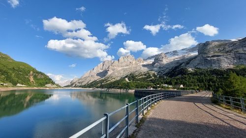 Scenic view of lake and mountains against sky