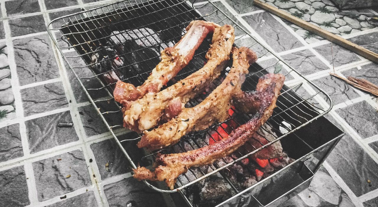 preparation, barbecue grill, barbecue, meat, food and drink, food, grilled, heat - temperature, close-up, cooking, high angle view, iron - metal, preparing food, fire - natural phenomenon, freshness, roasted, group of objects, firewood, day, burning, sausage, outdoors, barbeque