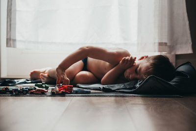 Man lying down on bed at home