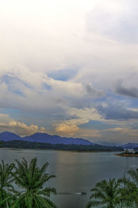 Scenic view of lake against sky at sunset