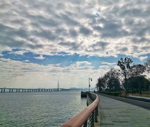 Bridge over sea against sky