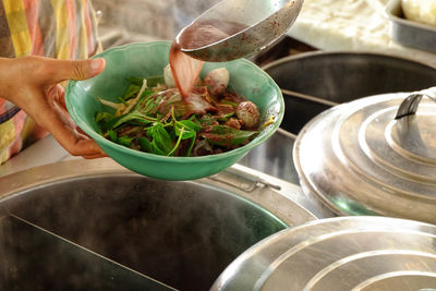 High angle view of person preparing food in container