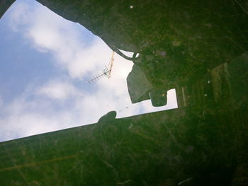 Low angle view of man standing on puddle