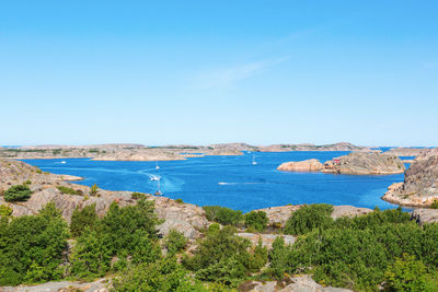 Scenic view of sea against blue sky