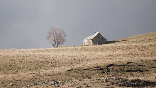 House on field against sky