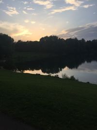 Scenic view of lake against sky during sunset