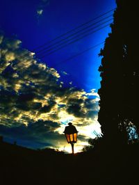 Low angle view of silhouette building against sky at dusk