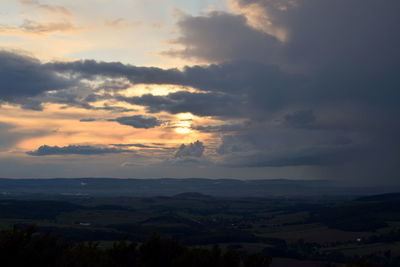 Scenic view of storm clouds over landscape