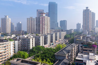 Modern buildings in city against sky