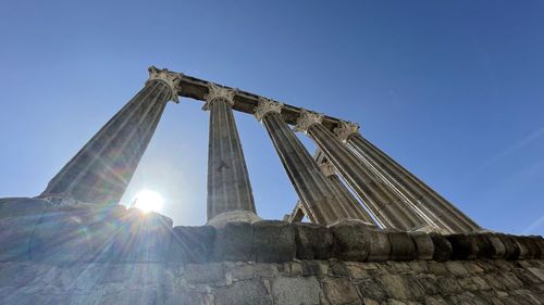 Low angle view of historical building against blue sky
