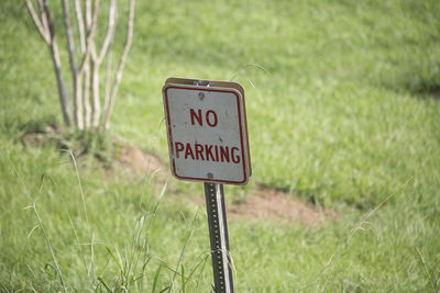 Close up of a leaning no parking sign