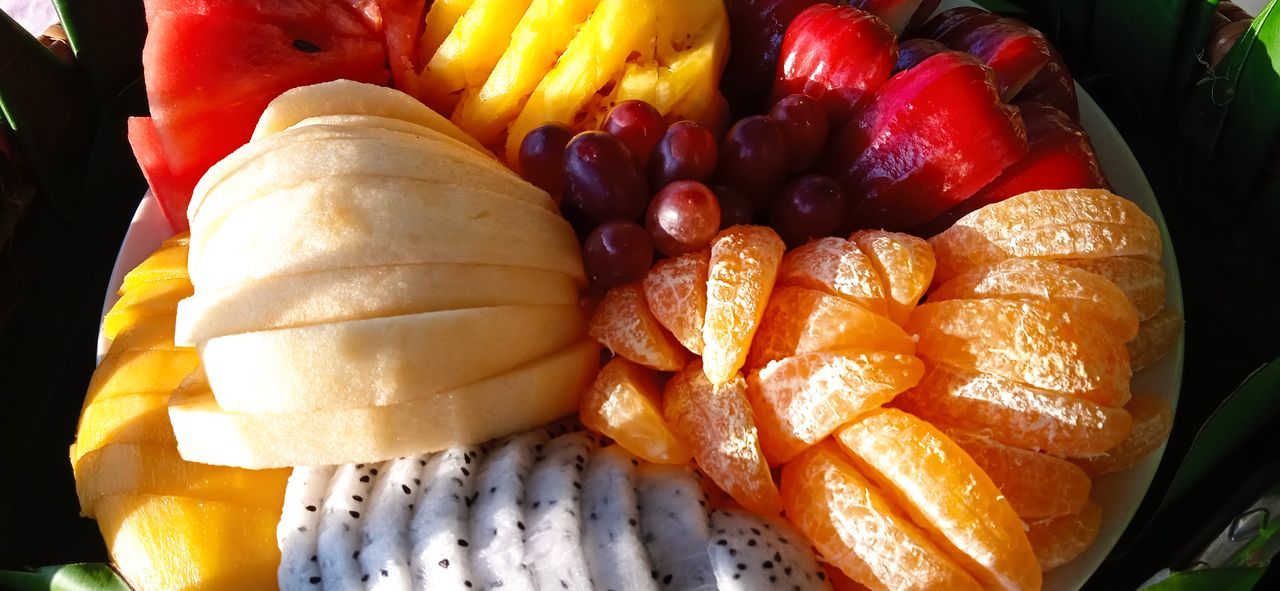 food, food and drink, freshness, healthy eating, dish, fruit, produce, meal, no people, wellbeing, vegetable, plant, still life, variation, cuisine, close-up, fast food, high angle view, banana, garnish, multi colored, sweet food, orange color, indoors