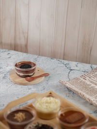 High angle view of layered chocolate dessert cup on table