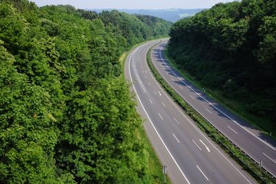 High angle view of highway amidst trees