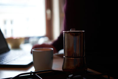 Close-up of coffee cup on table