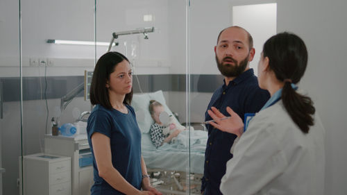 Parent talking with doctor at hospital