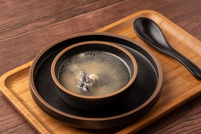 High angle view of black tea on table