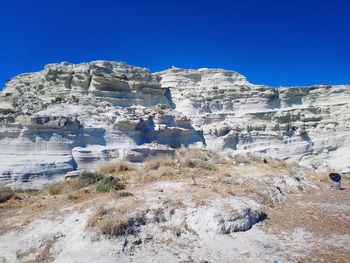 Scenic view of rocky mountains against clear blue sky