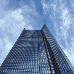 Low angle view of building against cloudy sky