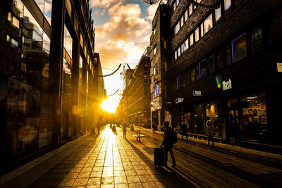 Illuminated city street at night