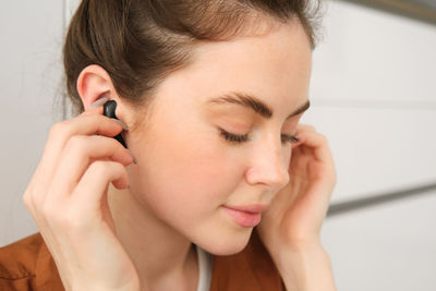 Close-up of young woman looking away