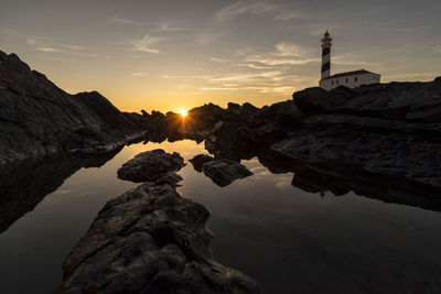 Rock formations against sky during sunset