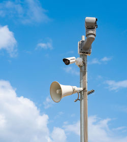 Low angle view of street light against sky