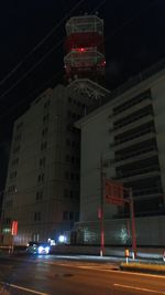 Low angle view of illuminated road at night