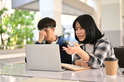 Young woman using laptop at home