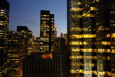 Illuminated buildings in city at night