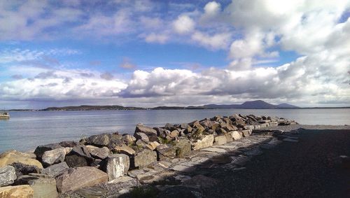 Scenic view of sea against cloudy sky