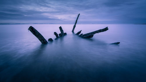 Shipwreck in sea at night