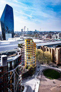 High angle view of city buildings against sky