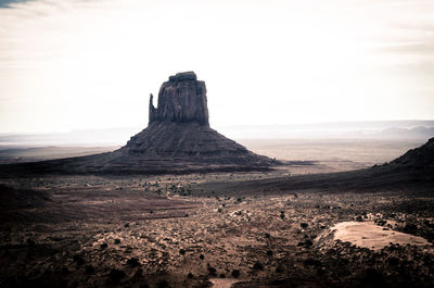 Rock formations on landscape against sky