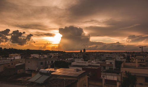 High angle view of townscape against sky during sunset