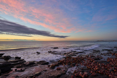 Scenic view of sea against sky during sunset