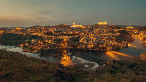 Illuminated cityscape at night