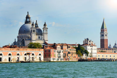 View of castle by sea against sky