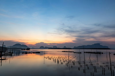 Scenic view of lake against sky during sunset