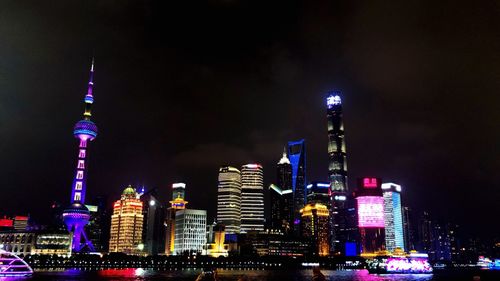 Illuminated buildings in city at night