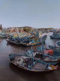Boats moored at harbor