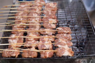 High angle view of meat on barbecue grill