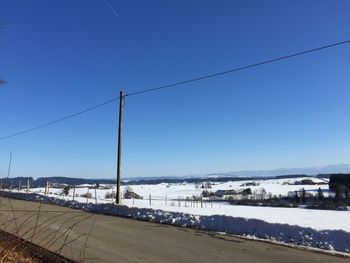 Scenic view of sea against clear sky during winter