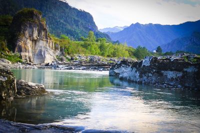 Scenic view of river flowing through rocks