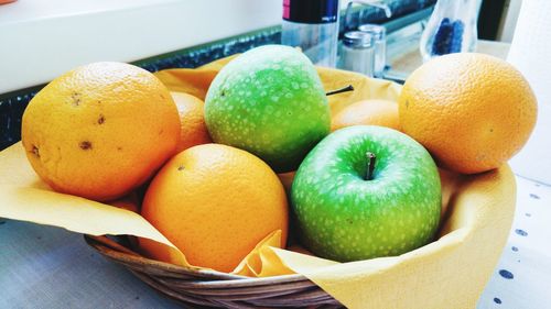 Close-up of fruits in basket on table