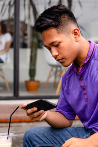 Young man using mobile phone