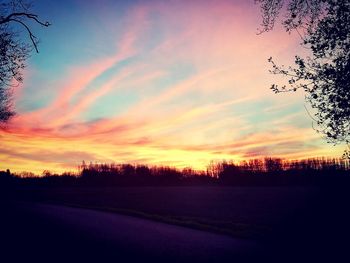 Scenic view of silhouette trees against sky at sunset